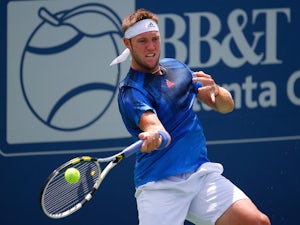 Jack Sock collapses on court