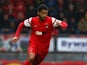 Jobi McAnuff of Leyton Orient looks to get past Jordan Turnball of Swindon during the Sky Bet League One match between Leyton Orient and Swindon Town at The Matchroom Stadium on October 04, 2014