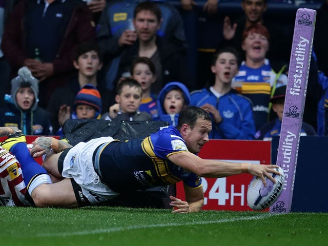 Danny McGuire of Leeds Rhinos scores a try during the Round 2 match of the First Utility Super League Super 8s between Leeds Rhinos and Wigan Warriors at Headingley Carnegie Stadium on August 14, 2015