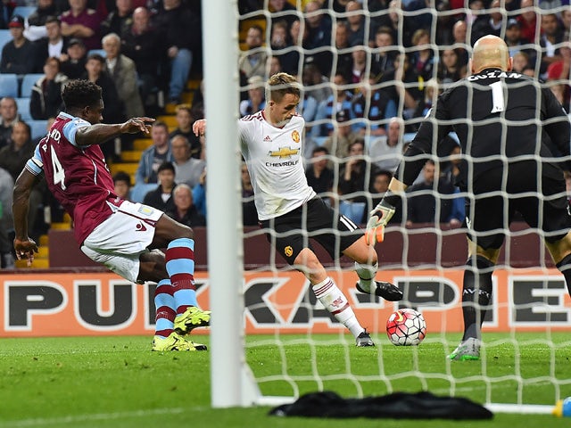 Manchester United's Belgian midfielder Adnan Januzaj scores his team's first goal during the English Premier League football match between Aston Villa and Manchester United at Villa Park in Birmingham, central England, on August 14, 2015