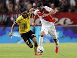 Lille's French midfielder Sofiane Boufal vies for the ball with Monaco's Moroccan midfielder Nabil Dirar (R) during the French L1 football match between Monaco and Lille on August 14, 2015