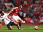 Morgan Schneiderlin of Manchester United and Mousa Dembele of Tottenham Hotspur compete for the ball during the Barclays Premier League match between Manchester United and Tottenham Hotspur at Old Trafford on August 8, 2015 in Manchester, England. 