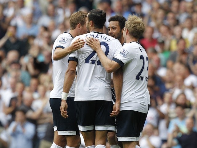 Nacer Chadli is congratulated by teammates after scoring Spurs' second against Stoke on August 15, 2015