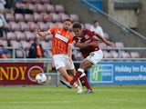 Dominic Calvert-Lewin of Northampton Town shoots to score his sides 2nd goal during the Capital One Cup First Round match between Northampton Town and Blackpool at Sixfields Stdium on August 11, 2015