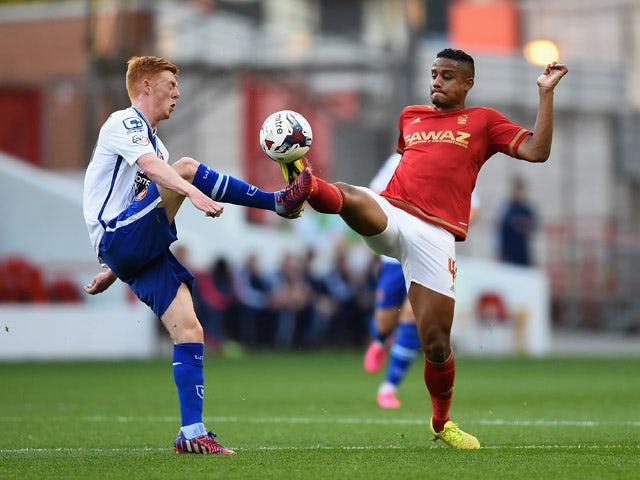 Michael Mancienne of Nottingam Forest battles with Reece Flanagan of Walsall during the Capital One Cup First Round match between Nottingham Forest and Walsall at City Ground on August 11, 2015