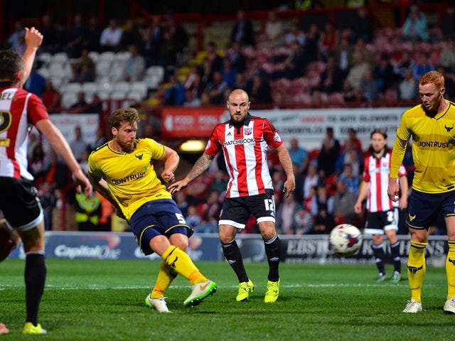 John Mullins of Oxford United scores Oxford's 4th goal during the Capital One Cup First Round match between Brentford and Oxford United at Griffin Park on August 11, 2015