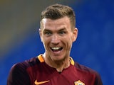 Roma's Bosnian forward Edin Dzeko celebrates after scoring during the friendly football match between Roma and Valencia at the Olympic stadium in Rome on August 14, 2015