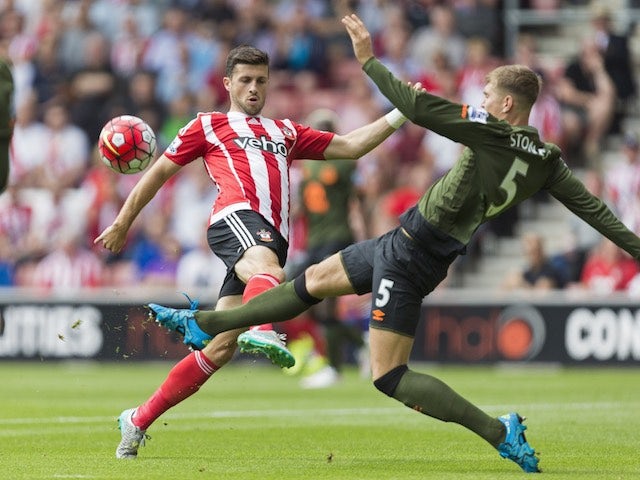 Southampton's Shane Long battles with John Stones of Everton on August 15, 2015