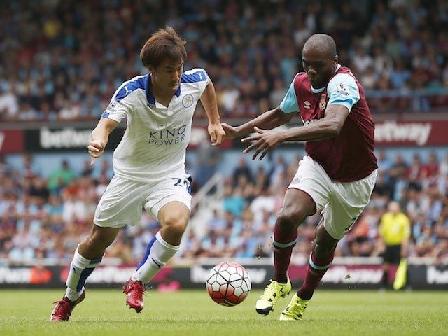 Leicester's Shinji Okazaki takes on Angelo Ogbonna of West Ham on August 15, 2015