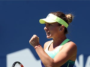 Halep battles into final four of Rogers Cup