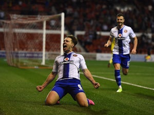 Tom Bradshaw of Walsall celebrates scoring the winning goal during the Capital One Cup First Round match between Nottingham Forest and Walsall at City Ground on August 11, 2015