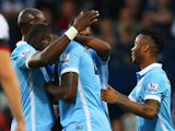 Yaya Toure of Manchester City (2L) is congratulated by team mates as he scores their first goal during the Barclays Premier League match between West Bromwich Albion and Manchester City at The Hawthorns on August 10, 2015