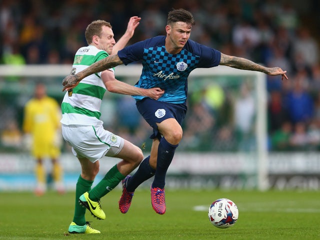 Marc Laird of Yeovil Town challenges Ben Gladwin of Queens Park Rangers during the Capital One Cup First Round match between Yeovil Town and Queens Park Rangers at Huish Park on August 11, 2015