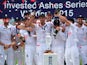 England's captain Alastair Cook holds up the replica Ashes urn as England players celebrate their series victory after the fourth day of the fifth Ashes cricket test match between England and Australia at The Oval cricket ground in London, on August 23, 2