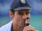 England's captain Alastair Cook kisses the replica Ashes urn as England celebrate their series victory after the fourth day of the fifth Ashes cricket test match between England and Australia at The Oval cricket ground in London, on August 23, 2015