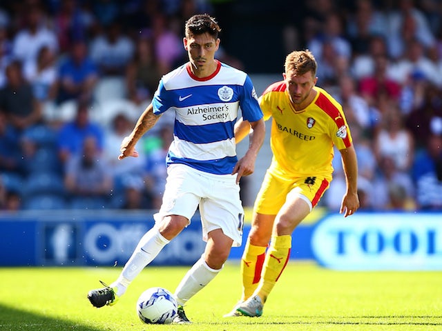 Alejandro Faurlin of QPR takes the ball past Lee Frecklington of Rotherham during the Sky Bet Championship match between Queens Park Rangers and Rotherham United at Loftus Road on August 22, 2015