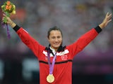 Turkey's gold medalist Asli Cakir poses on the podium of the women's 1500m at the athletics event of the London 2012 Olympic Games on August 11, 2012