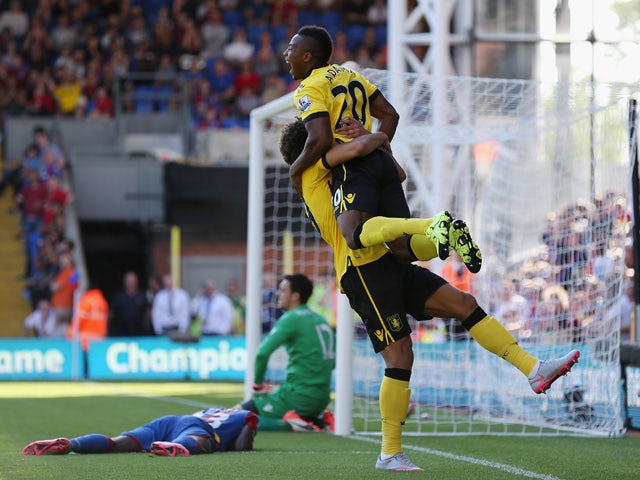 Adama Traore and Rudy Gestede of Aston Villa celebrate their team's third goal scored by Pape N'Diaye Souare of Crystal Palace (1st L) during the Barclays Premier League match between Crystal Palace and Aston Villa at Selhurst Park on August 22, 2015