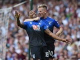 Callum Wilson (L) of Bournemouth celebrates scoring his team's second goal with his team mate Matt Ritchie (R) during the Barclays Premier League match between West Ham United and A.F.C. Bournemouth at the Boleyn Ground on August 22, 2015