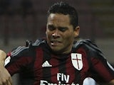 Carlos Bacca (R) of AC Milan is challenged by Massimo Volta (L) of AC Perugia during the TIM Cup match between AC Milan and AC Perugia at Stadio Giuseppe Meazza on August 17, 2015