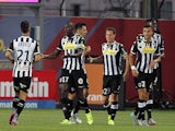 Angers' Senegalese midfielder Cheikh N'Doye (C) is congratulated by teammates after scoring a goal during the French L1 football match GFC Ajaccio (GFCA) against Angers (SCO) on August 22, 2015
