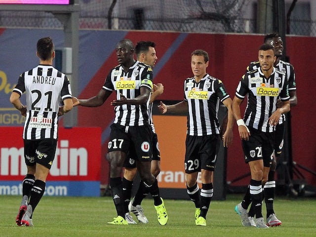 Angers' Senegalese midfielder Cheikh N'Doye (C) is congratulated by teammates after scoring a goal during the French L1 football match GFC Ajaccio (GFCA) against Angers (SCO) on August 22, 2015
