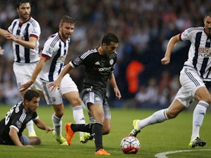 Chelsea's Spanish midfielder Pedro (C) runs with the ball in the build up to scoring the opening goal of the English Premier League football match between West Bromwich Albion and Chelsea at The Hawthorns in West Bromwich, central England on August 23, 20