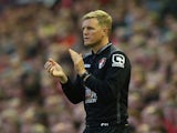 Eddie Howe manager of Bournemouth applauds during the Barclays Premier League match between Liverpool and A.F.C. Bournemouth at Anfield on August 17, 2015