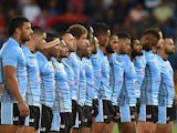 Players of Fiji stand during the national anthem before the International Test Match between TOA Samoa and Tonga at Cbus Super Stadium on May 2, 2015