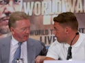 Frank Warren chats to Billy Joe Saunders during a press conference on August 17, 2015
