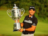 Jason Day poses with the Wanamaker Trophy after winning the PGA on August 16, 2015