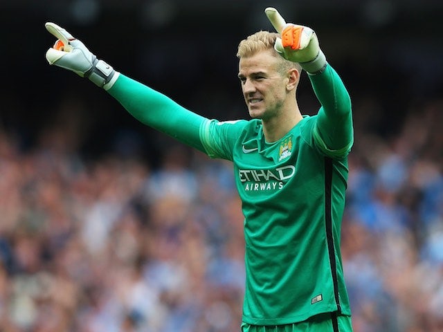 Man City keeper Joe Hart celebrates his side's second goal against Chelsea on August 16, 2015