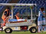 Lazio's defender from Netherlands Stefan de Vrij is carried out of the pitch after getting injured during the UEFA Champions League playoff football match between Lazio and Bayer Leverkusen, at Olympic stadium in Rome on August 18, 2015