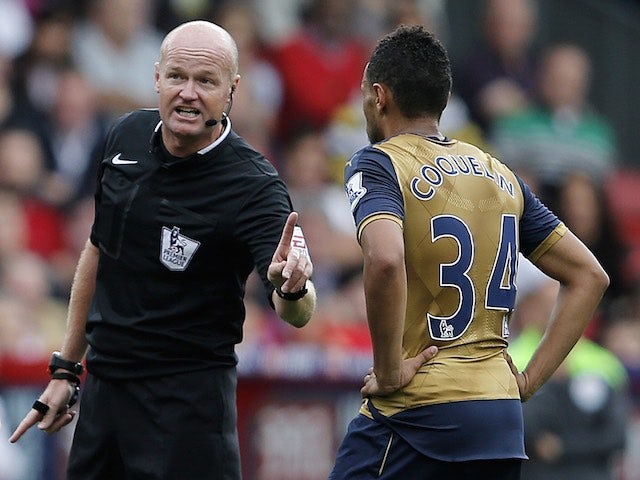 Sassy referee Lee Mason waggles a finger at Francis Coquelin during Arsenal's game at Palace on August 16, 2015