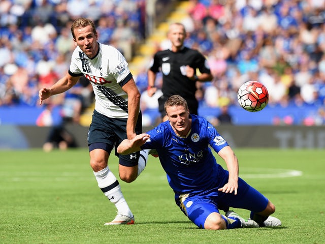 Harry Kane of Tottenham Hotspur and Robert Huth of Leicester City compete for the ball during the Barclays Premier League match between Leicester City and Tottenham Hotspur at The King Power Stadium on August 22, 2015
