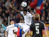 Tel Aviv's Nigerian midfielder Nosa Igiebor heads the ball between Basel's Swiss forward Breel Embolo (L) and Basel's Swiss defender Michael Lang during the UEFA Champions League playoff football match between FC Basel and Maccabi Tel Aviv at the St Jakob