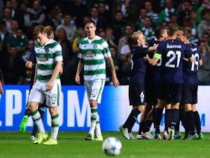 The Malmo players celebrate together after Jo Inge Berget goal early in the second half during the UEFA Champions League Qualifying play off first leg match, between at Celtic Park on August 19, 2015