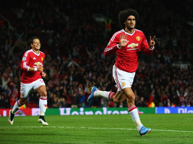 Marouane Fellaini of Manchester United celebrates scoring his team's third goal during the UEFA Champions League Qualifying Round Play Off First Leg match between Manchester United and Club Brugge at Old Trafford on August 18, 2015