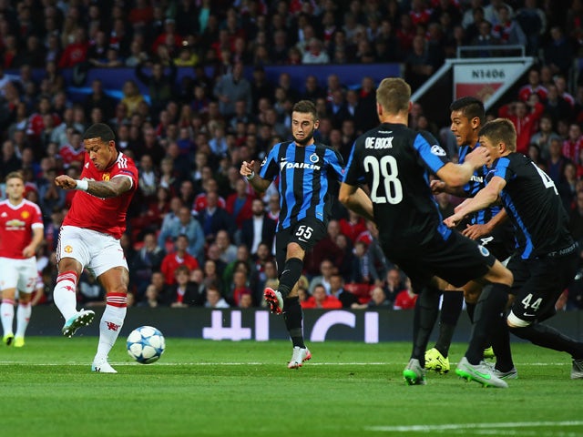 Memphis Depay of Manchester United scores his team's opening goal during the UEFA Champions League Qualifying Round Play Off First Leg match between Manchester United and Club Brugge at Old Trafford on August 18, 2015