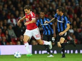 Matteo Darmian of Manchester United goes past Claudemir of Club Brugge during the UEFA Champions League Qualifying Round Play Off First Leg match between Manchester United and Club Brugge at Old Trafford on August 18, 2015
