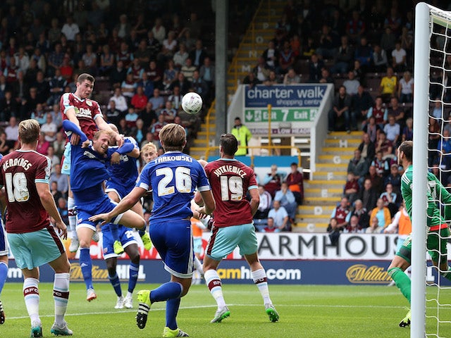 Michael Keane of Burnley scores the opening goal during the Sky Bet Championship match between Burnley and Brentford at Turf Moor on August 22, 2015