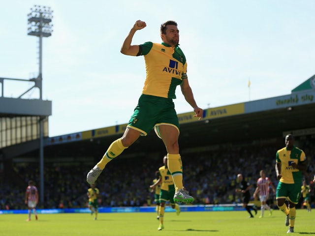 Russel Martin of Norwich City celebrates scoring his team's first goal during the Barclays Premier League match between Norwich City and Stoke City at Carrow Road on August 22, 2015
