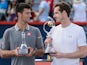Novak Djokovic and Andy Murray pose with their trophies after the Rogers Cup on August 16, 2015