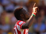 Mame Biram Diouf of Stoke City celebrates scoring his team's first goal during the Barclays Premier League match between Norwich City and Stoke City at Carrow Road on August 22, 2015