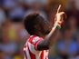 Mame Biram Diouf of Stoke City celebrates scoring his team's first goal during the Barclays Premier League match between Norwich City and Stoke City at Carrow Road on August 22, 2015