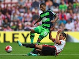 Kyle Naughton of Swansea City and Jack Rodwell of Sunderland compete for the ball during the Barclays Premier League match between Sunderland and Swansea City at the Stadium of Light on August 22, 2015