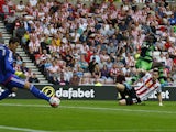 Swansea City's French striker Bafetimbi Gomis (top right) scores the opening goal against Sunderland during the English Premier League football match between Sunderland and Swansea City at the Stadium of Light in Sunderland, north east England on August 2