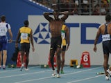 Jamaica's Usain Bolt (2L) reacts after making a false start in the final of the men's 100 metres at The International Association of Athletics Federations (IAAF) World Championships in Daegu on August 28, 2011