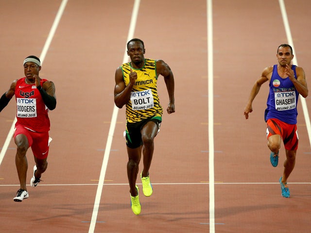 Mike Rodgers of the United States, Usain Bolt of Jamaica and Reza Ghasemi of Iran compete in the Men's 100 metres heats during day one of the 15th IAAF World Athletics Championships Beijing 2015 at Beijing National Stadium on August 22, 2015