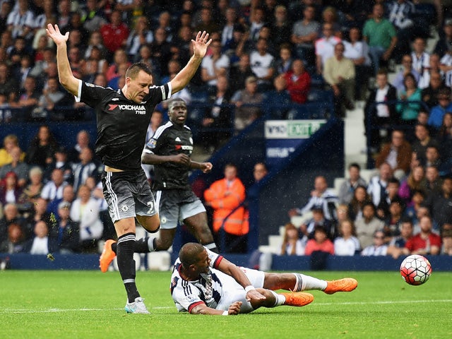 John Terry of Chelsea challenges Salomon Rondon of West Bromwich Albion leading to his red card during the Barclays Premier League match between West Bromwich Albion and Chelsea at The Hawthorns on August 23, 2015